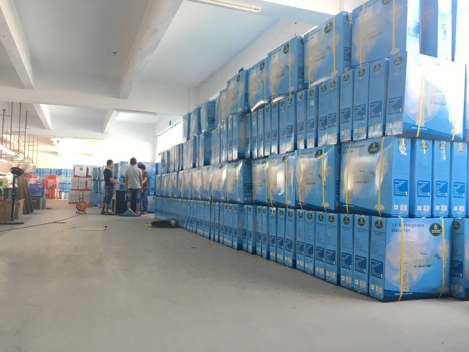Fan cartons staged for shipment in a warehouse